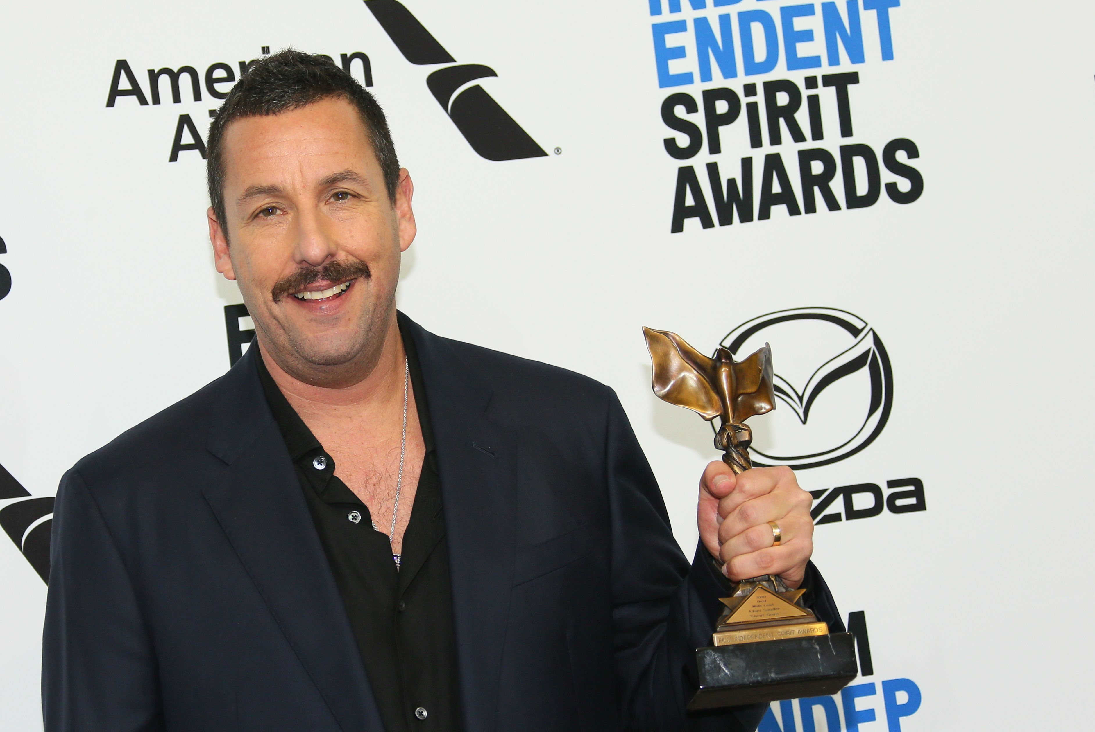 Actor Adam Sandler poses in the press room during the 35th Film Independent Spirit Awards in Santa Monica, California