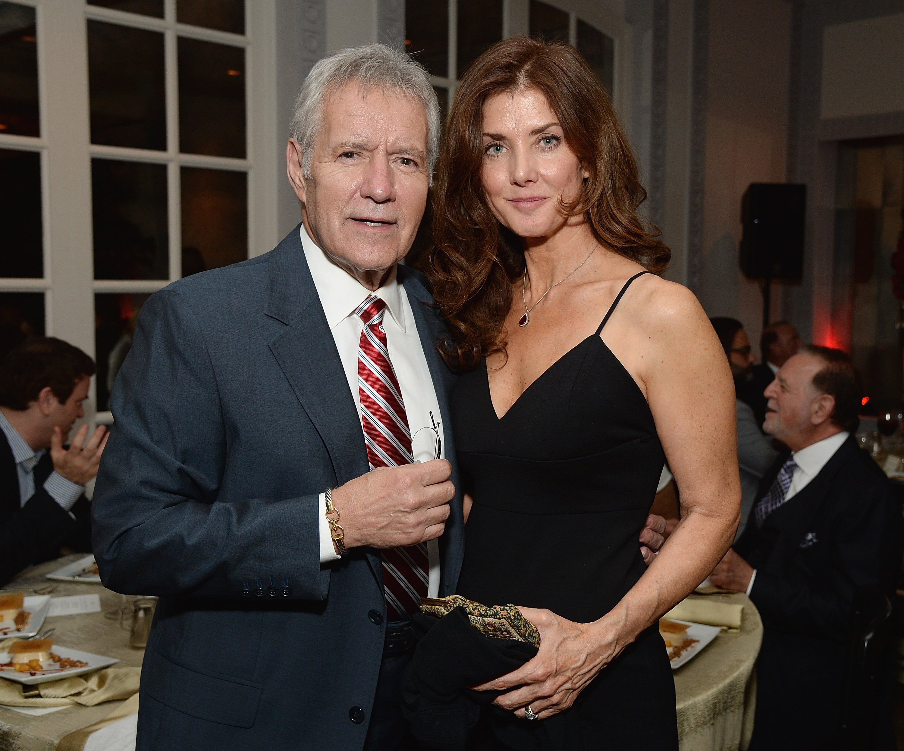 'Jeopardy!' star Alex Trebek and his wife, Jean Trebek smile for cameras as they attend the celebratory dinner after the special tribute to Sophia Loren during the AFI FEST 2014 presented by Audi at Dolby Theatre