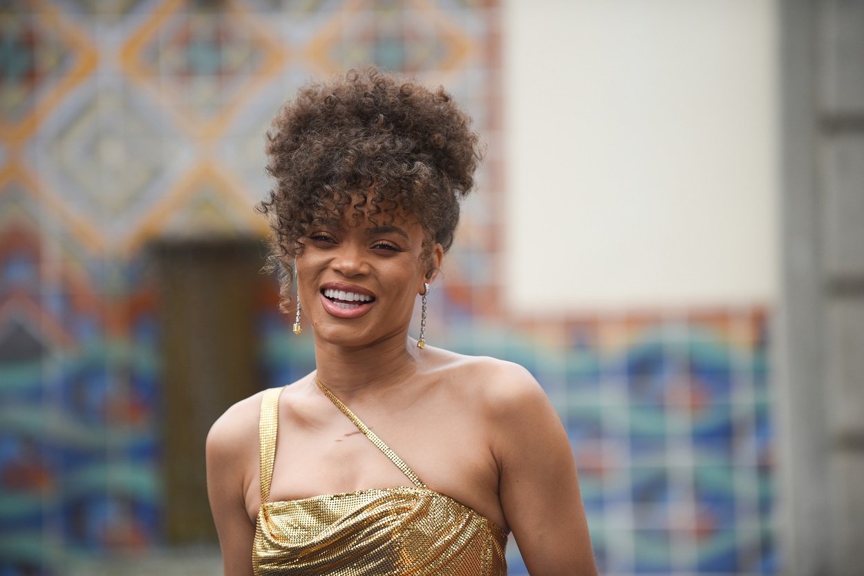 Andra Day arrives to the Oscars in a sparkly gold dress