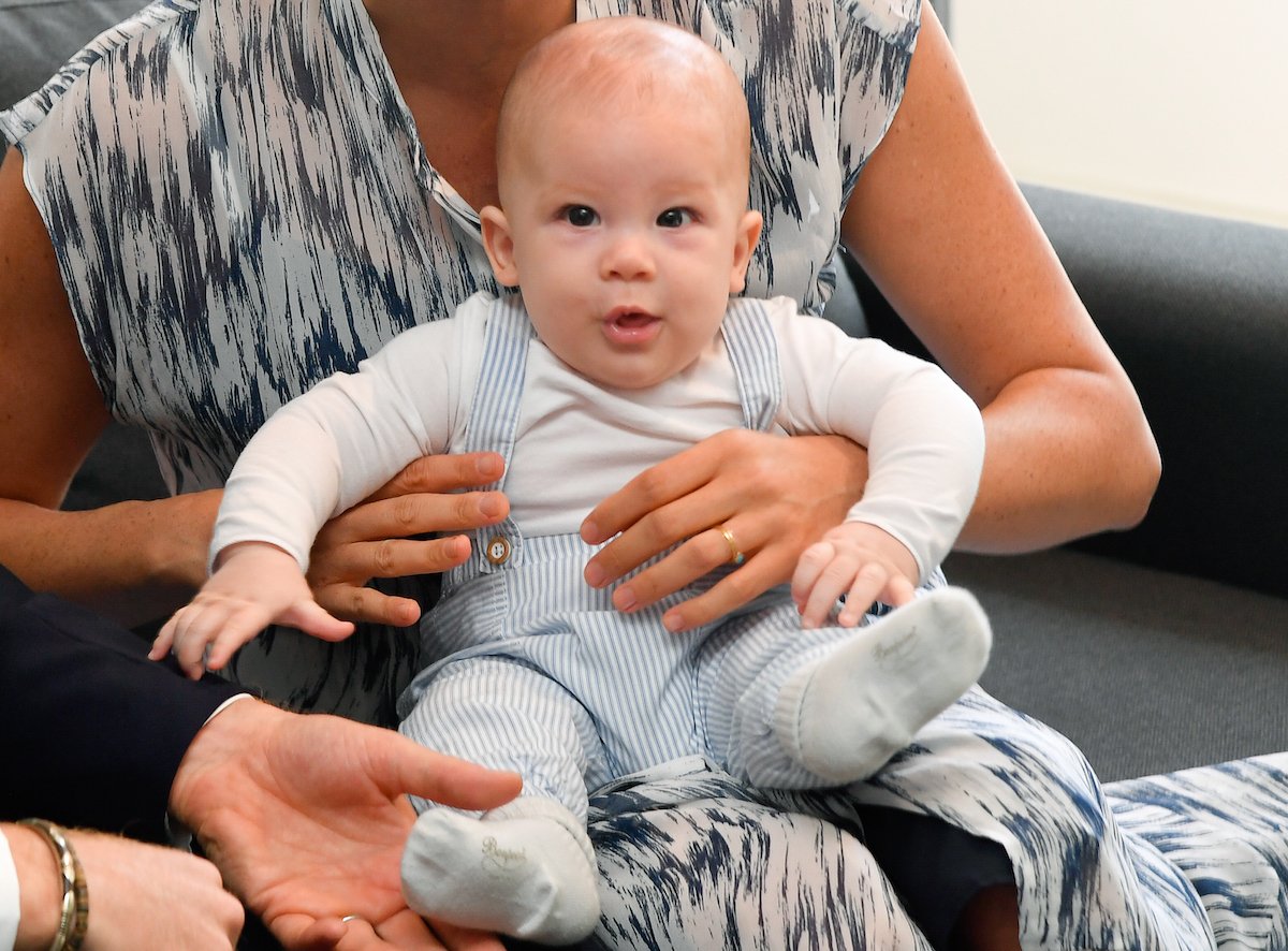 Britain's Meghan, Duchess of Sussex, holds her son Archie,