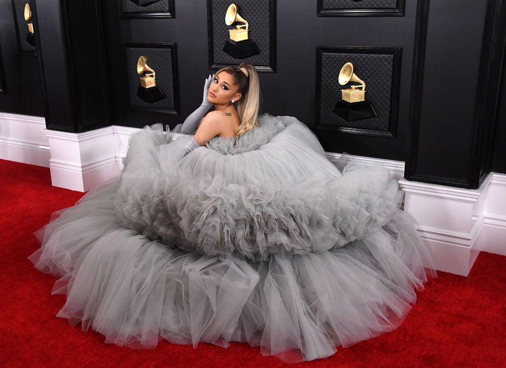 Ariana Grande poses on the red carpet in a silver ball gown at the 6nd Annual Grammy Awards.