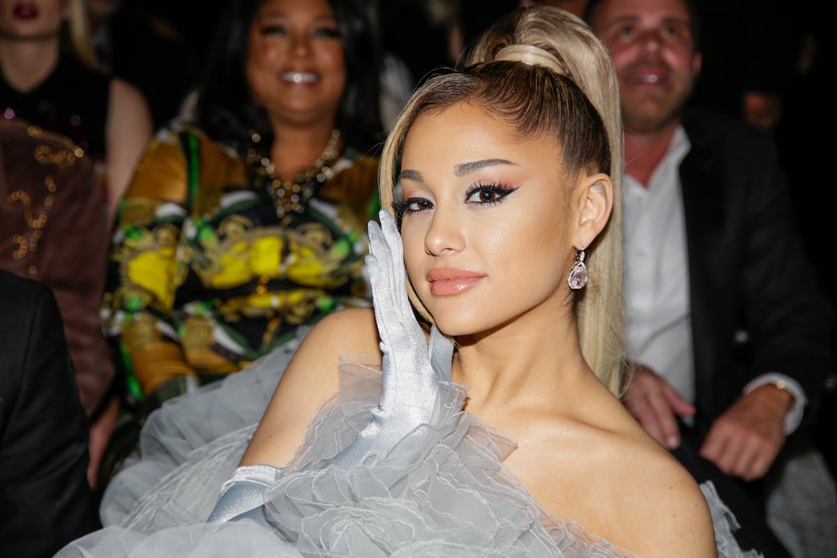 Ariana Grande wearing a fluffy grey dress