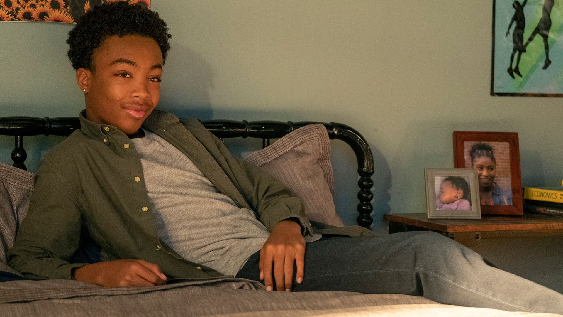 Asante Blackk as Malik sitting on a bed in ‘This Is Us’ Season 5 Episode 16