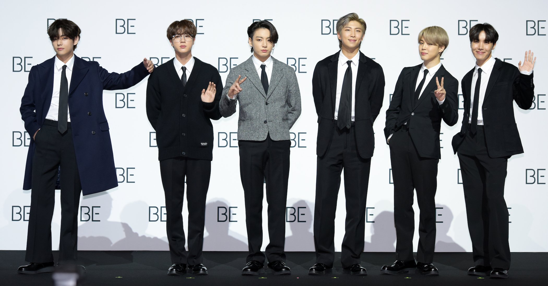 BTS members posing in a row