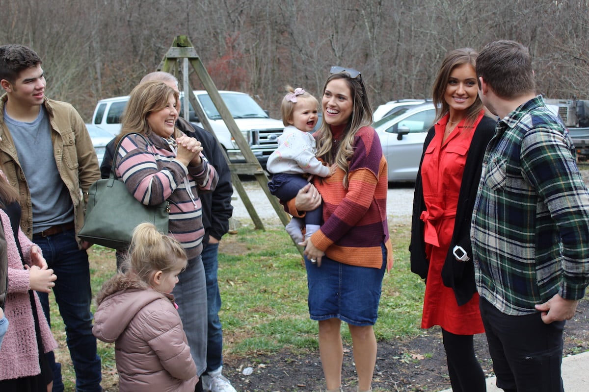 Members of the Bates family standing outside and talking in episode of Bringing Up Bates