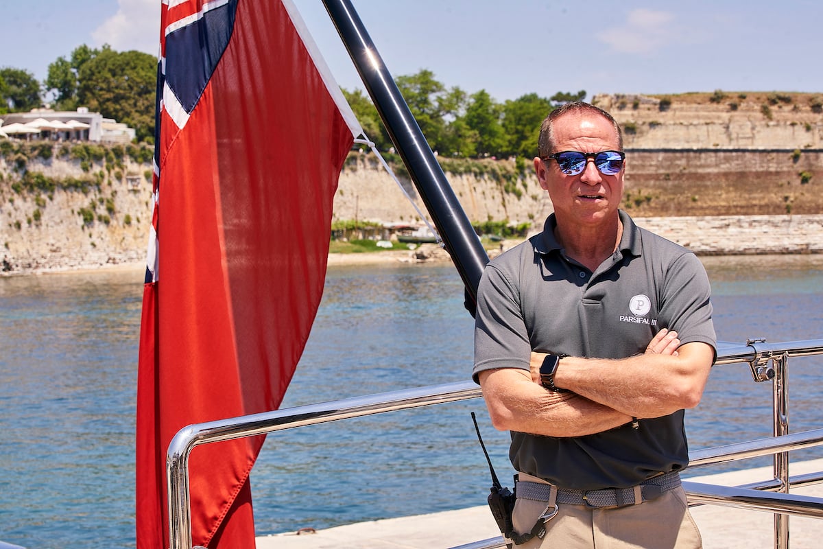 Captain Glenn Shephard from Below Deck Sailing Yacht on the bow of Parsifal III, which crashed during season 2