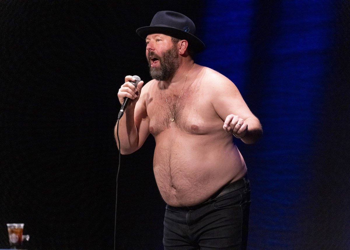 Bert Kreischer performing with his shirt off during his stand-up routines.