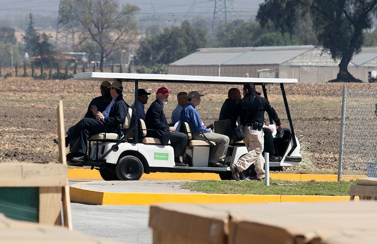 Billionaires Carlos Slim And Bill Gates ride a golf cart