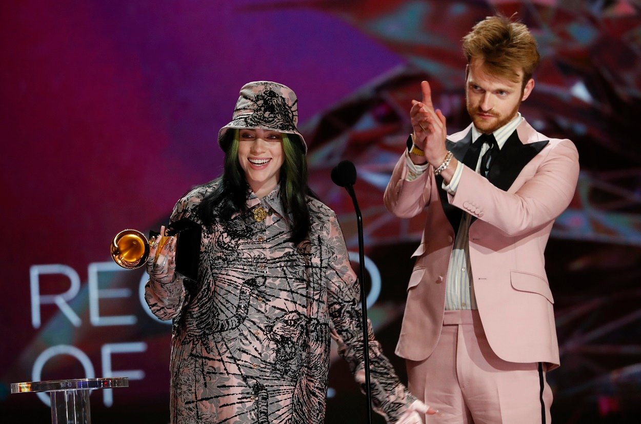 Billie Eilish and brother Finneas accept the award for Record of the Year at the Grammys