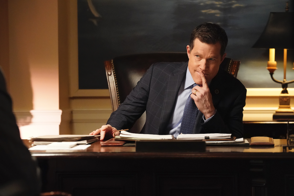Dylan Walsh as Mayor Peter Chase sits at a desk and looks up at someone on 'Blue Bloods'
