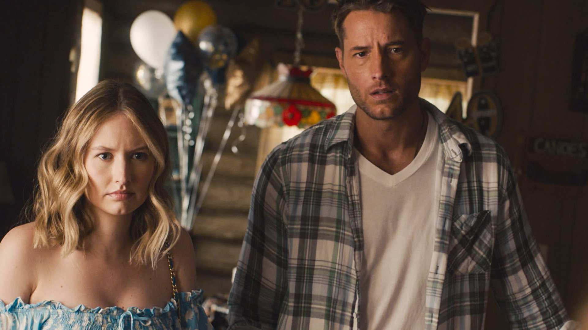 Caitlin Thompson as Madison and Justin Hartley as Kevin look shocked at the Pearson family cabin in ‘This Is Us’ Season 5 Episode 1