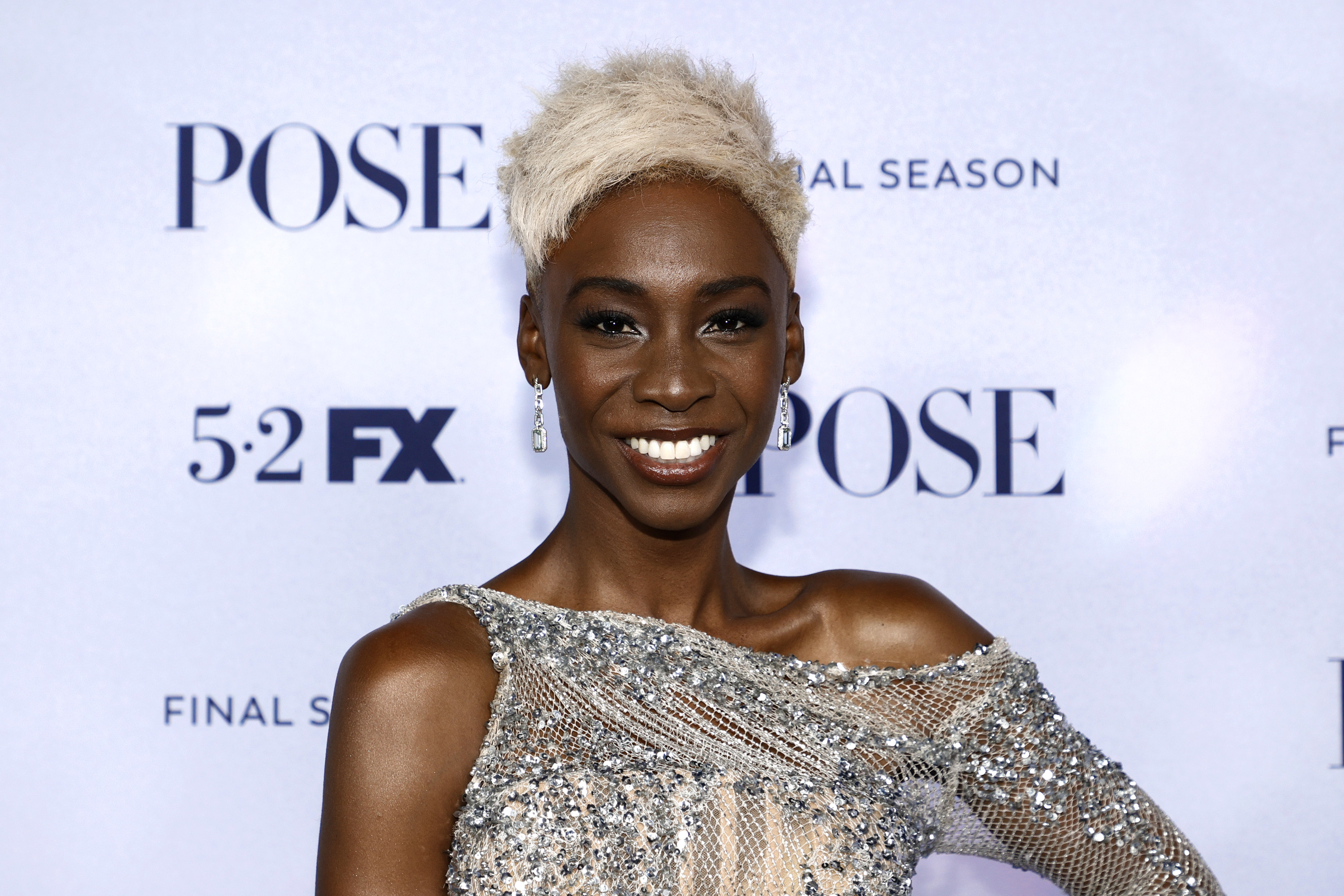 Angelica Ross, who played Candy on 'Pose' smiling while wearing a silver dress.