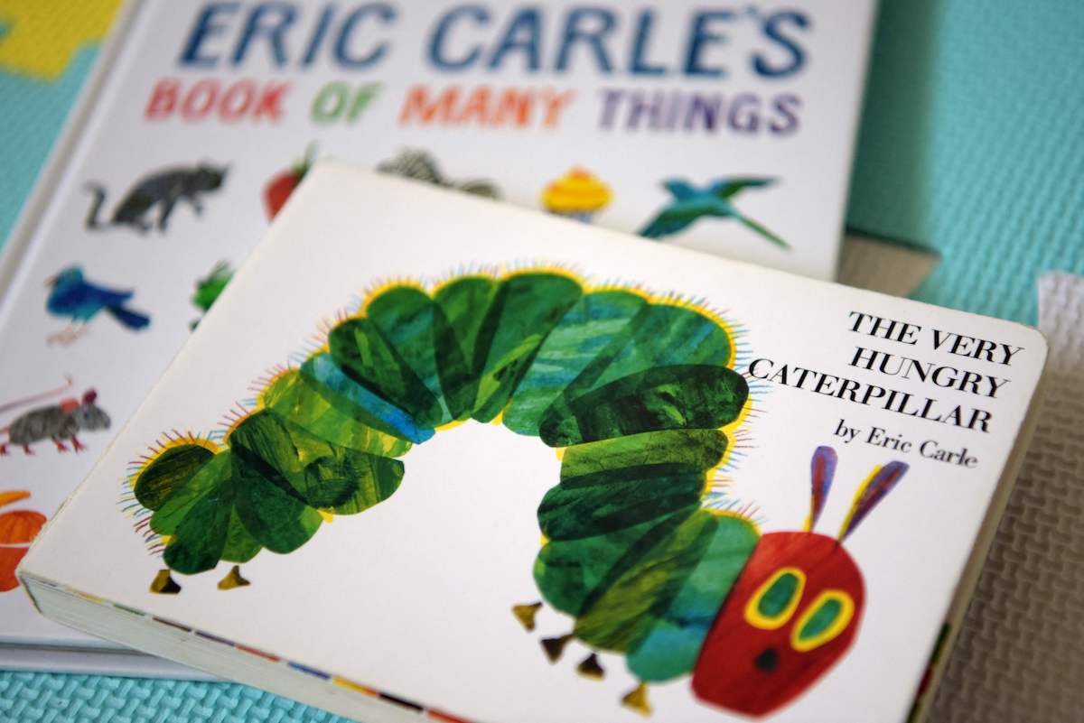 Eric Carle's "The Very Hungry Caterpillar" and "Book of Many Things" | AFP via Getty Images