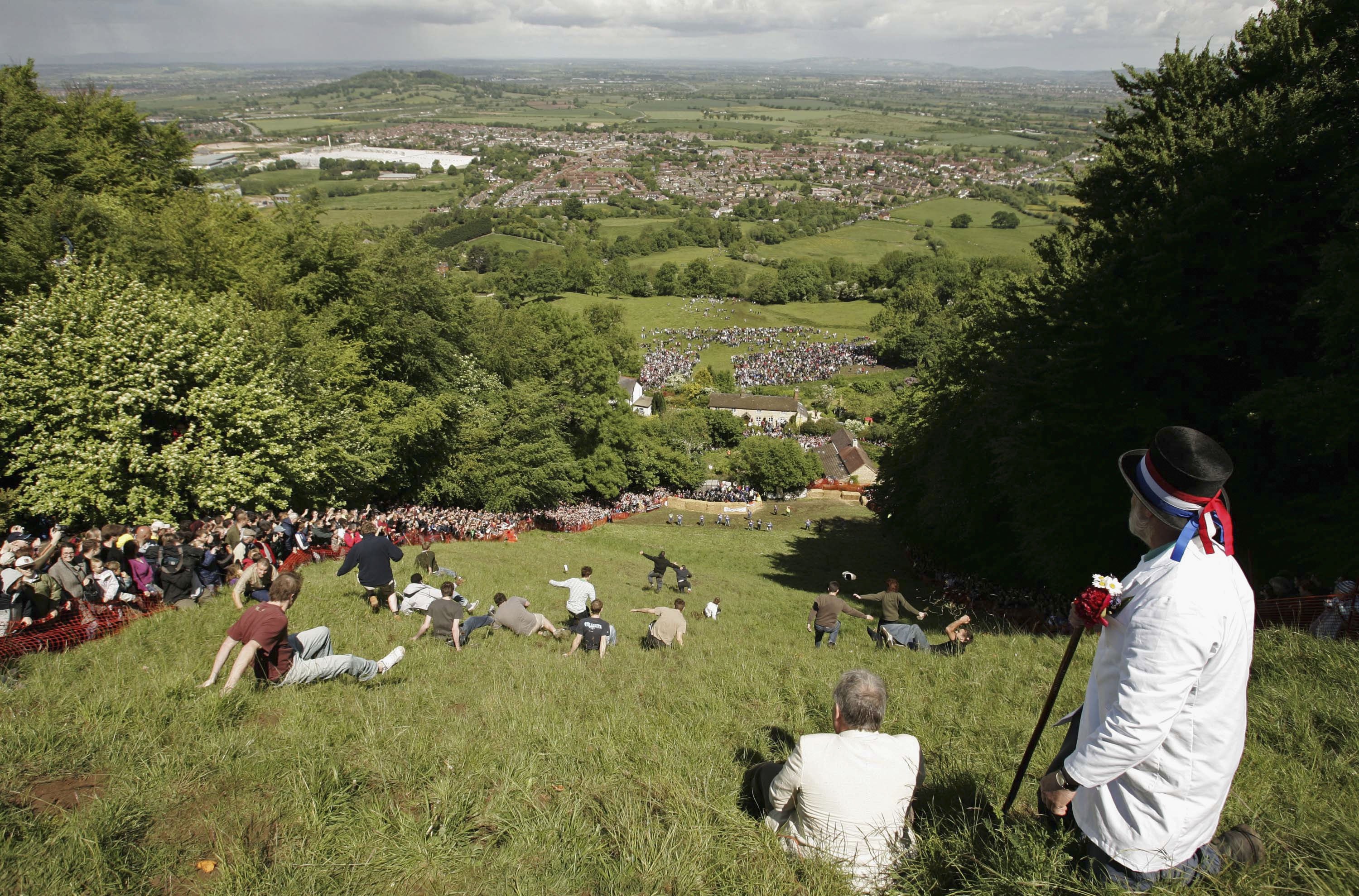 Cheese Rolling race is photographed from the top of Coopers Hill in Gloucester, England in May 2006