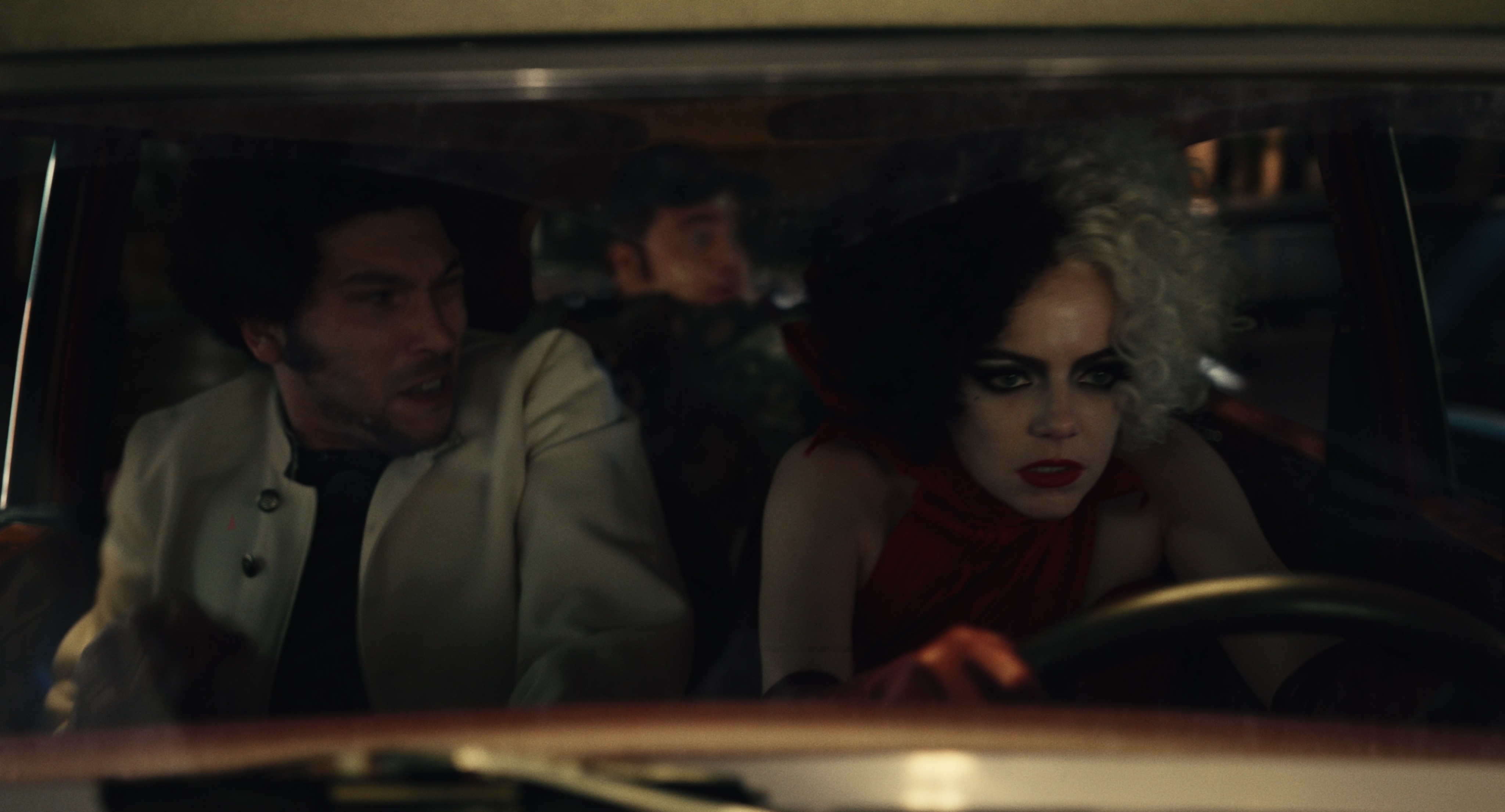 Cruella de Vil drives Horace and Jasper in a car