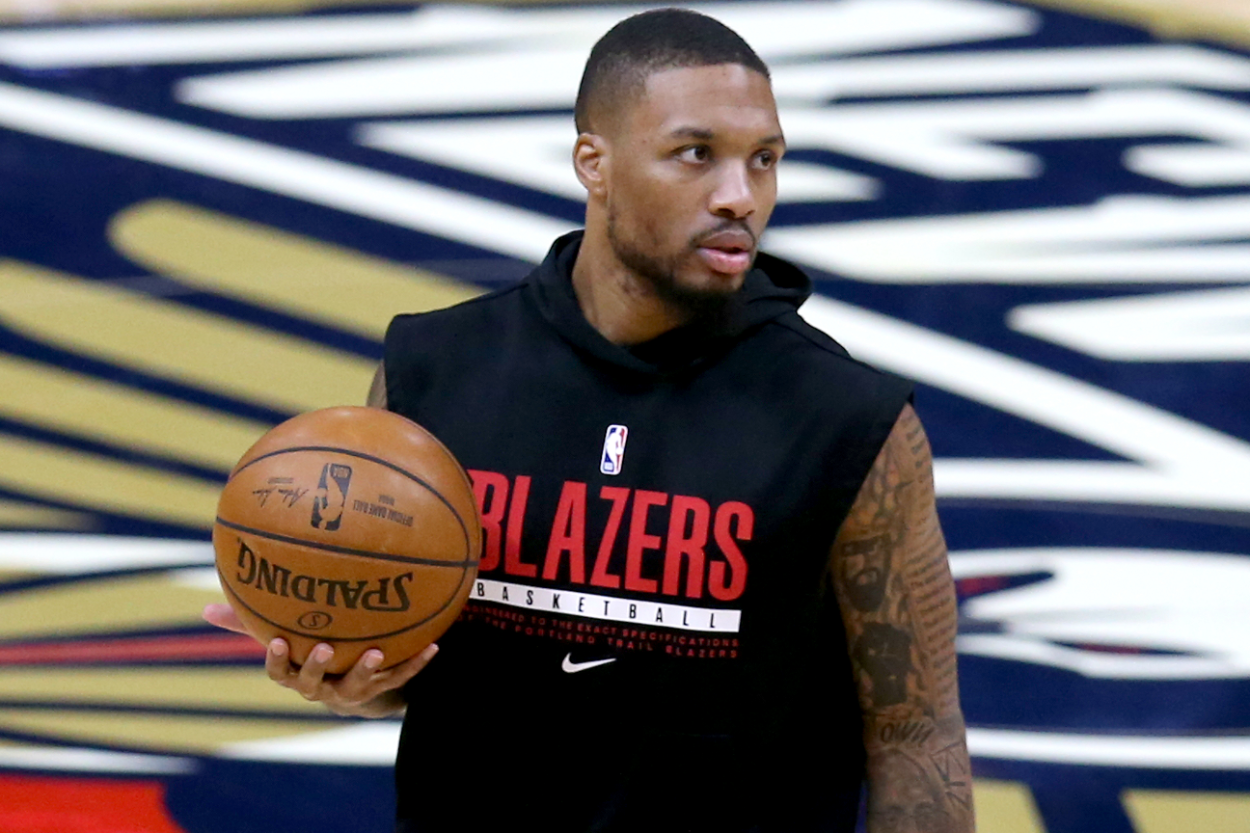 Damian Lillard 0 of the Portland Trail Blazers warms up prior to the start of an NBA game