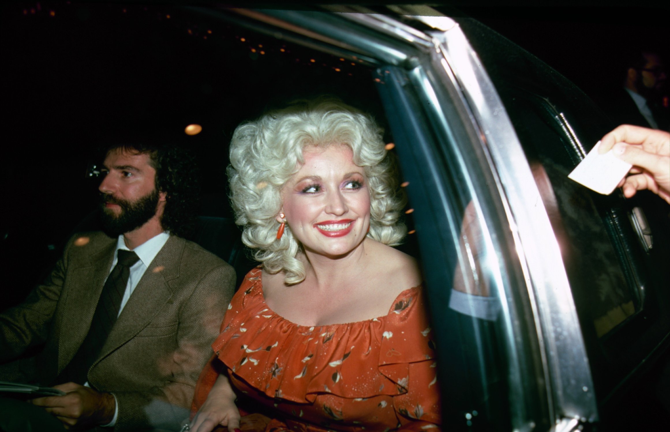 Dolly Parton in a car.