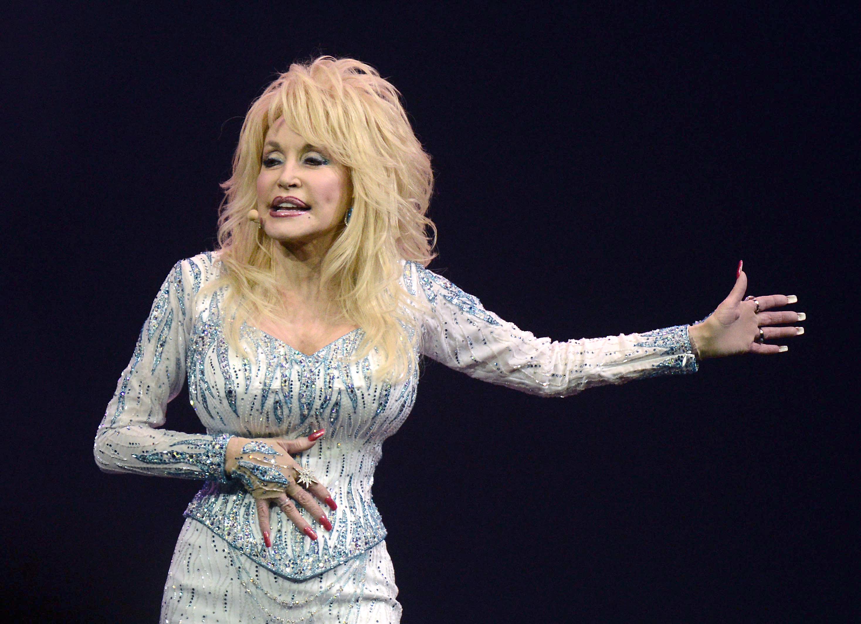 Dolly Parton performs at the Lanxess Arena concert venue in Cologne, Germany in 2014.