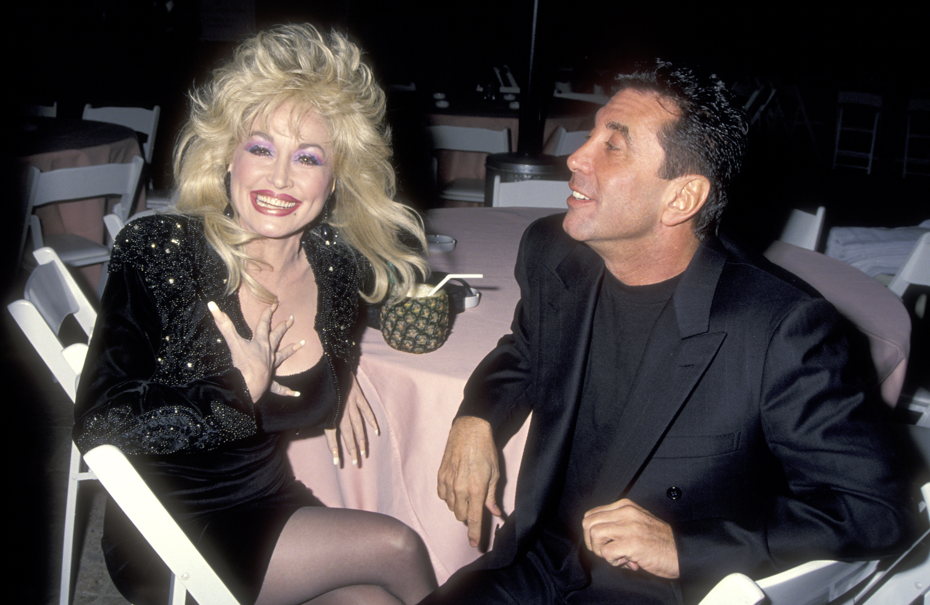 Musician Dolly Parton and Hollywood Manager/Producer Sandy Gallin attend the party to celebrate Kelly Klein's new book, 'Pools,' on November 19, 1992 at the Beverly Hills Hotel in Beverly Hills, California.