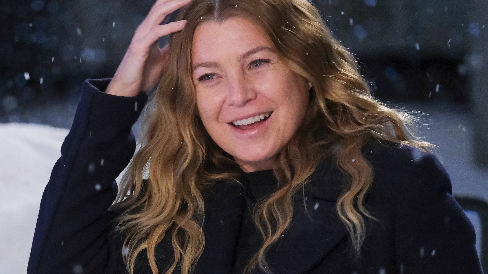 Ellen Pompeo as Meredith Grey wiping away fake snow in ‘Grey’s Anatomy’ Season 17