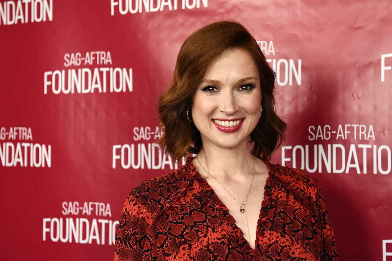 'The Office' cast member Ellie Kemper smiling on a red carpet in front of a backdrop with SAG-AFTRA Foundation logos