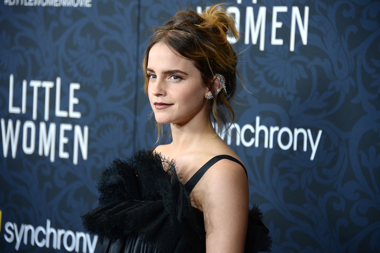 Emma Watson arrives to the Little Women world premiere in a black dress
