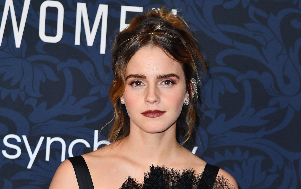 Emma Watson attends the movie premiere for Little Women is a black gown and stylish updo