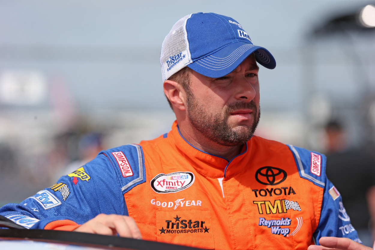 Eric McClure, driver of the 24 Hefty Toyota, waits for qualifying for the NASCAR XFINITY Owens Corning AttiCat 300 at Chicagoland Speedway