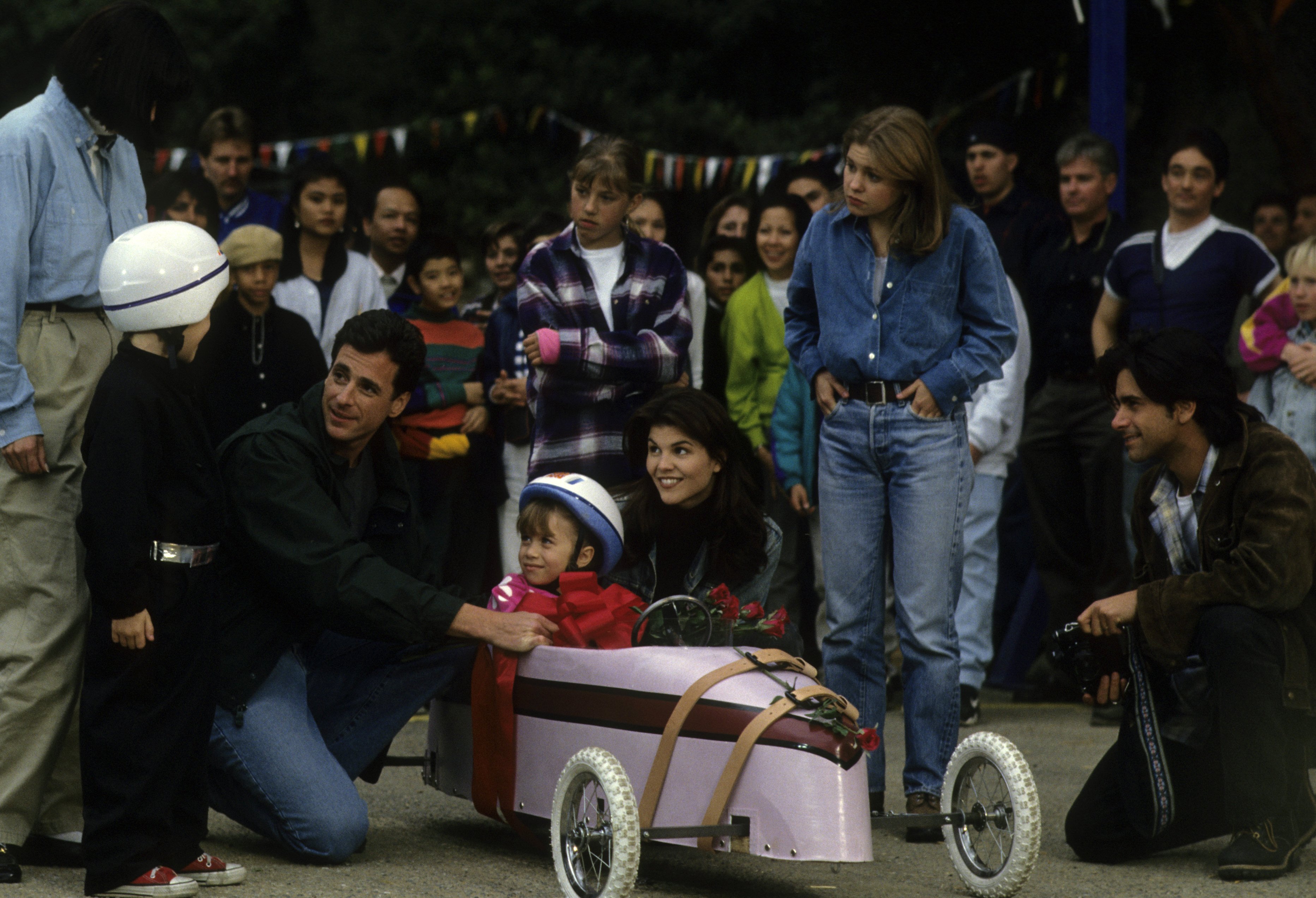 Bob Saget, John Stamos, and other cast members in 'Full House' episode titled 'Michelle A La Cart'