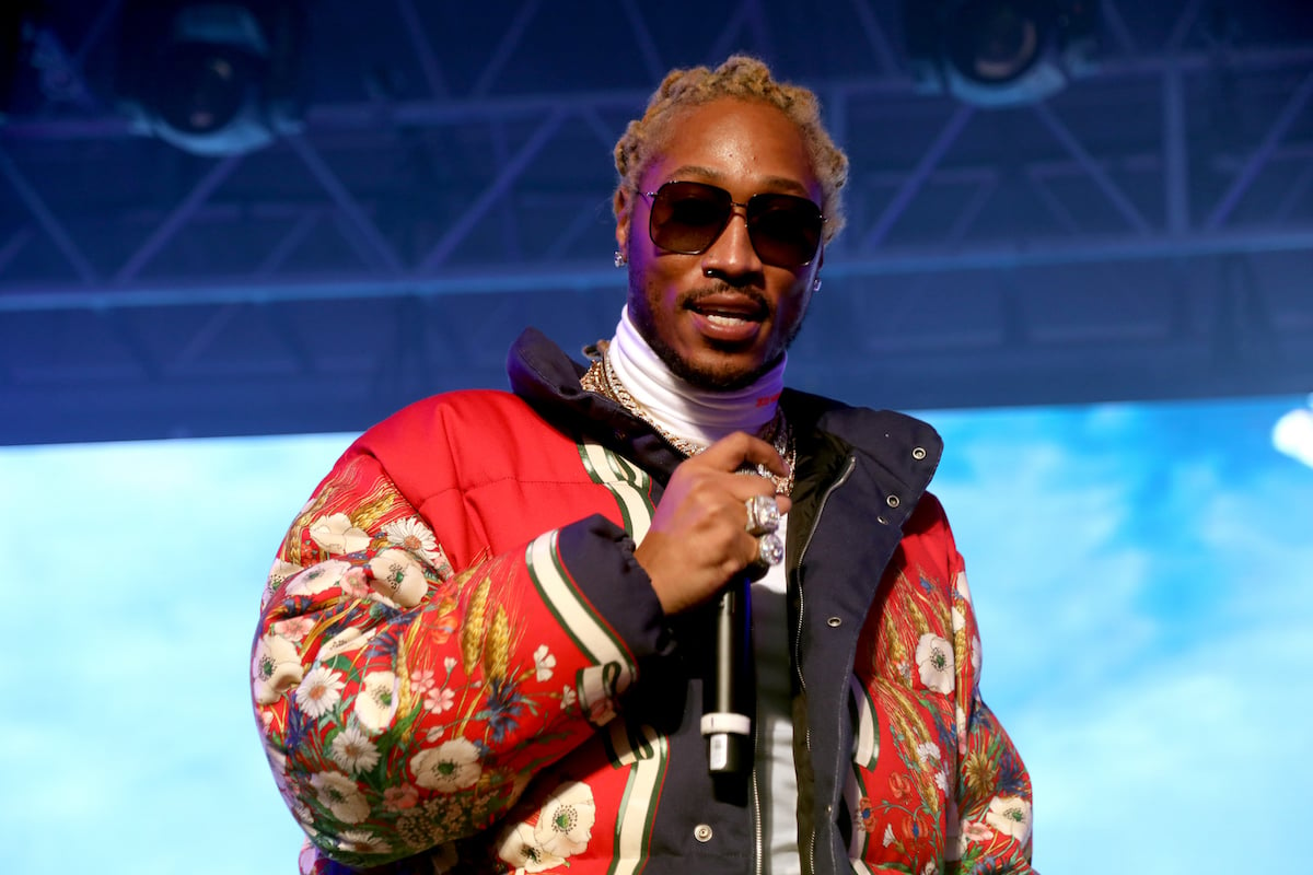 Future performing on stage in a red coat