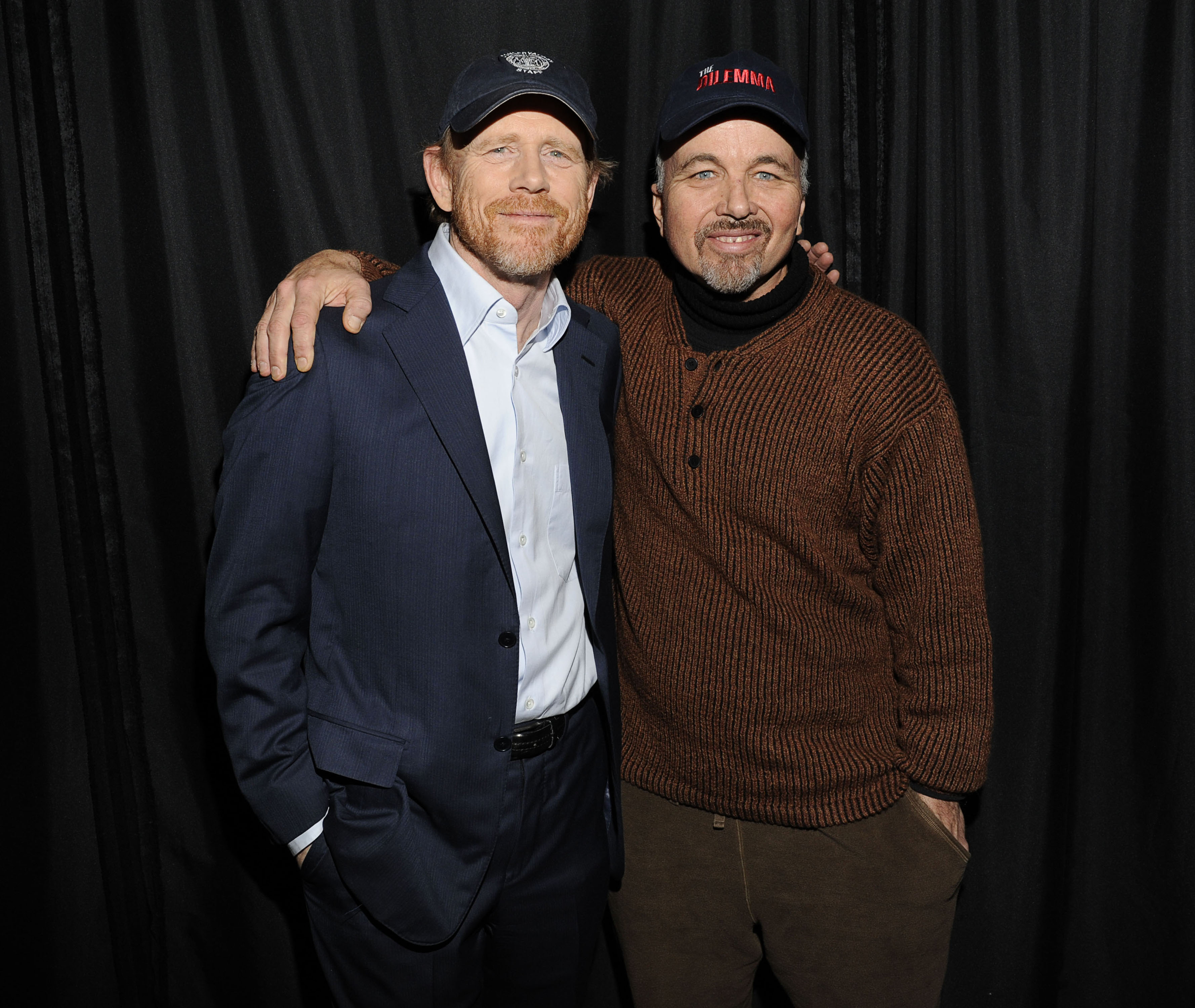 Brothers Ron Howard and Clint Howard pose with arms around each other's shoulders, 2011