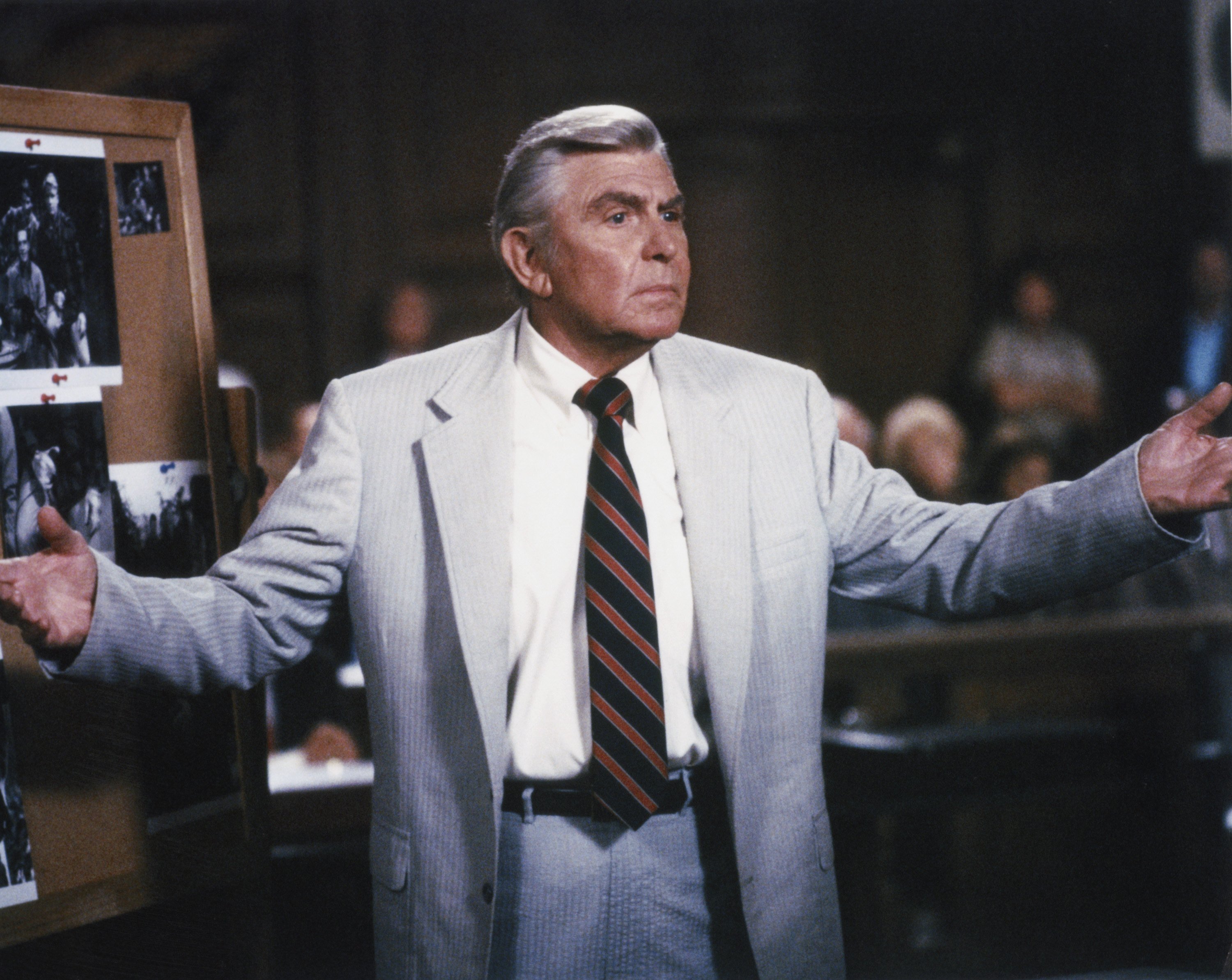 Andy Griffith stars as celebrated Atlanta attorney Benjamin Matlock and is pictured here addressing a courtroom in a scene from 'Matlock,' dressed in the character's classic gray suit.