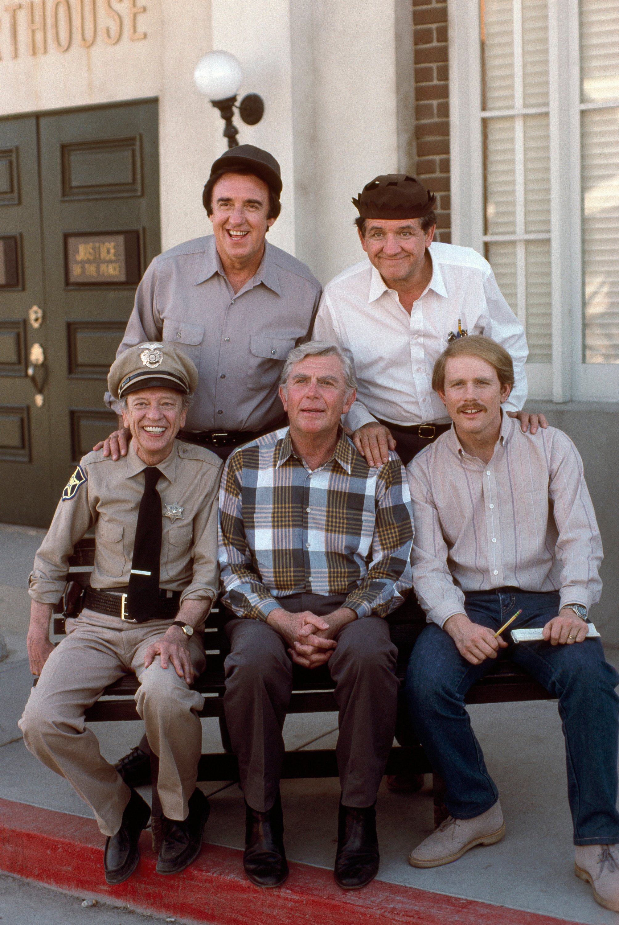 A few cast members from the 1986 television movie 'Return to Mayberry' pose for a photo: (back row l-r) Jim Nabors as Gomer Pyle, George Lindsey as Goober Pyle (front row l-r) Don Knotts as Barney Fife, Andy Griffith as Andy Taylor, Ron Howard as Opie Taylor