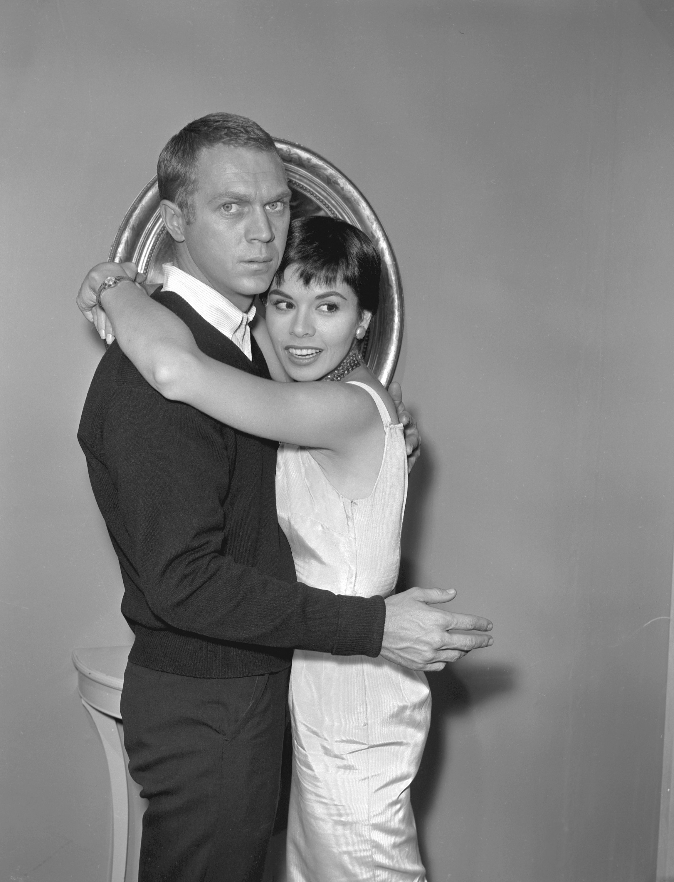 Steve McQueen, left, embraces his first wife Neile Adams in 1959