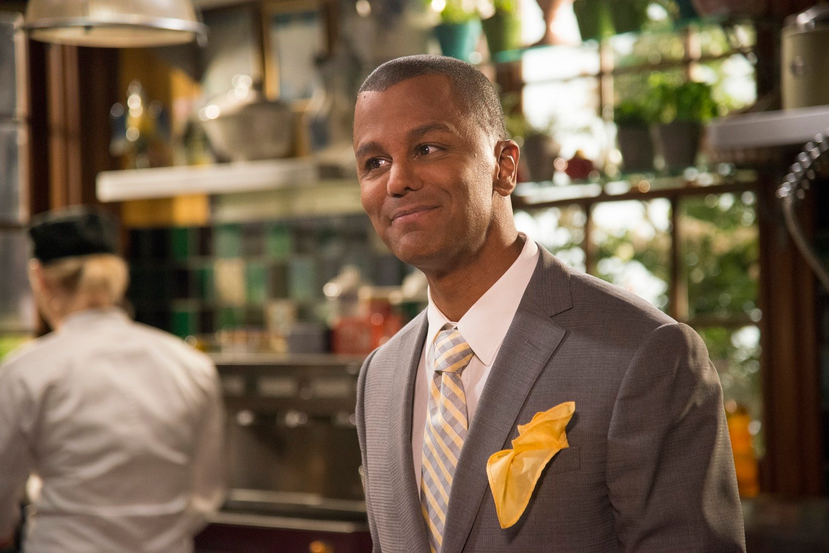 Yanic Truesdale as Michel Gerrard stands in the kitchen of the Dragonfly Inn in 'Gilmore Girls: A Year in the Life'