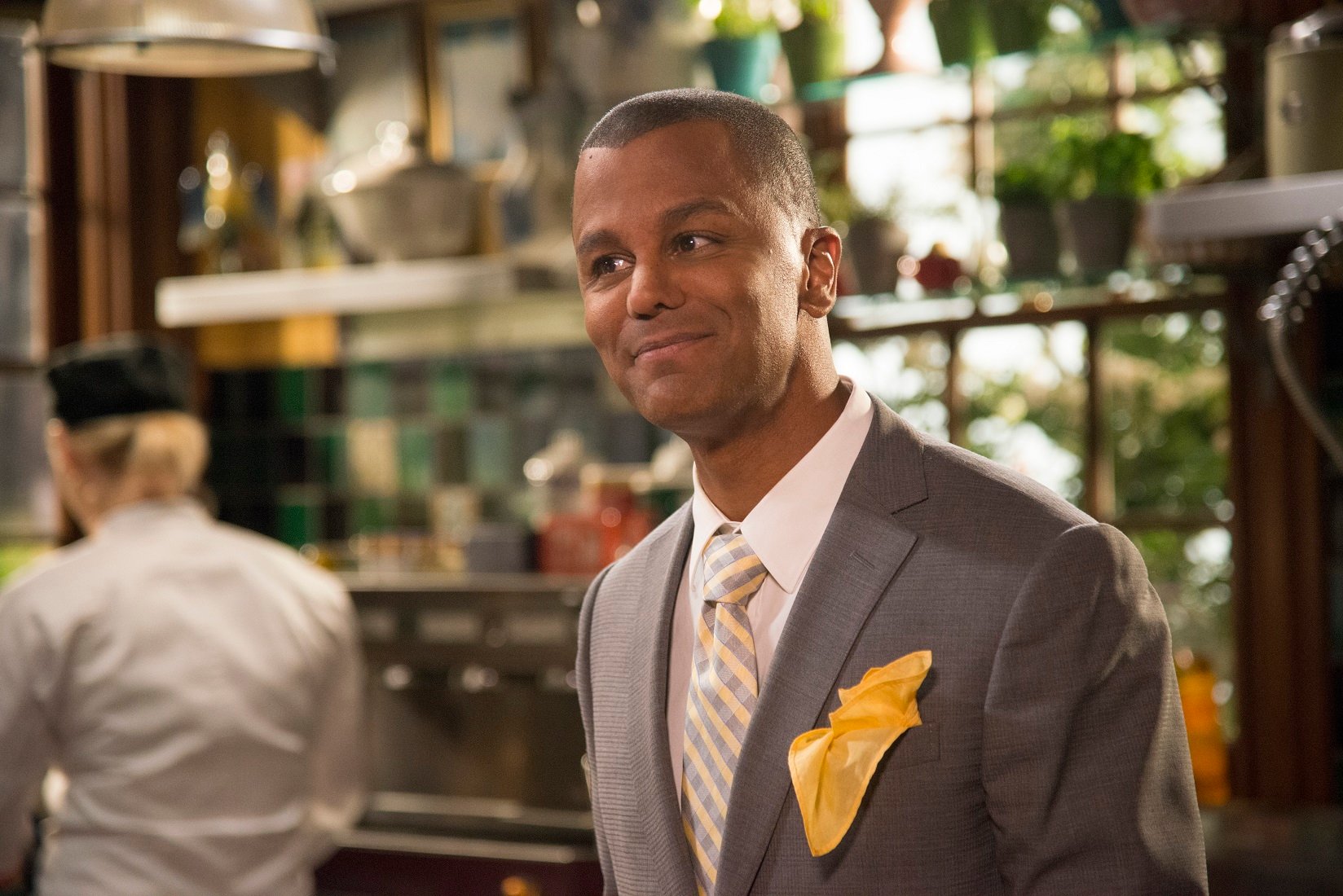Yanic Truesdale as Michel Gerrard stands in the kitchen of the Dragonfly Inn in 'Gilmore Girls: A Year in the Life' 