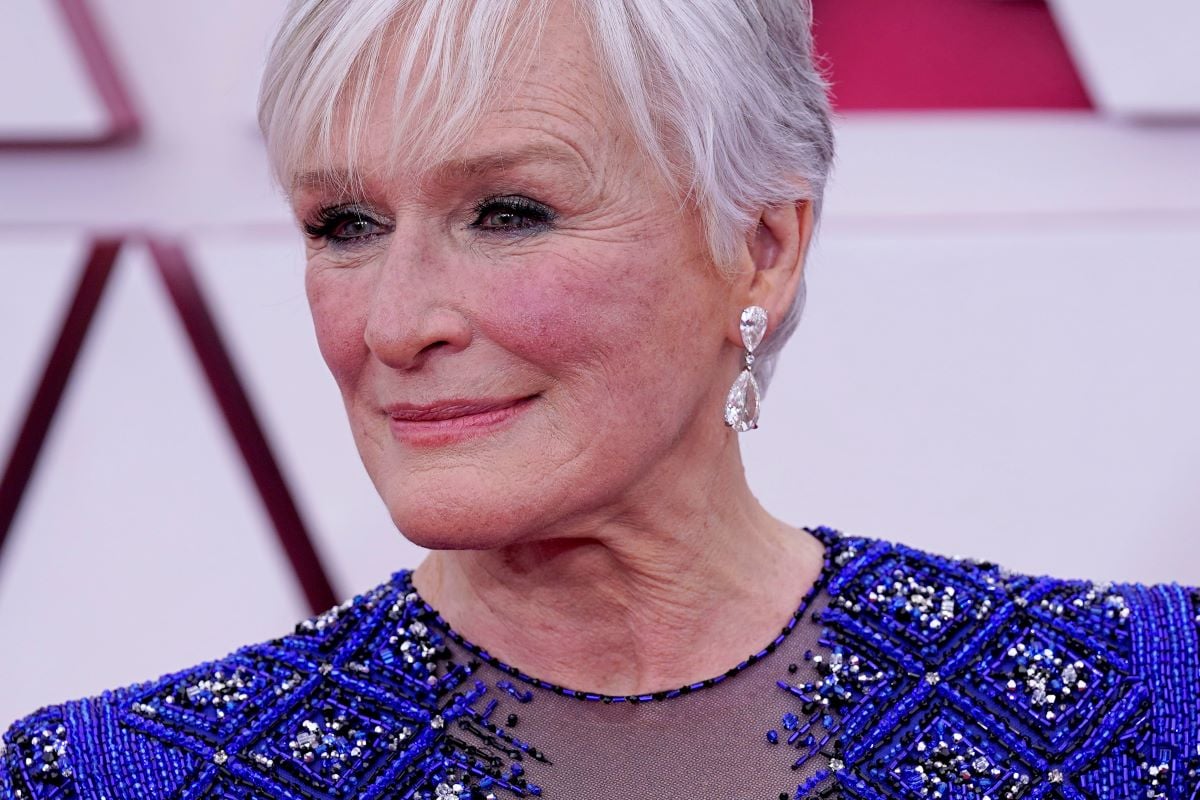 Glenn Close in blue dress with sparkly earrings