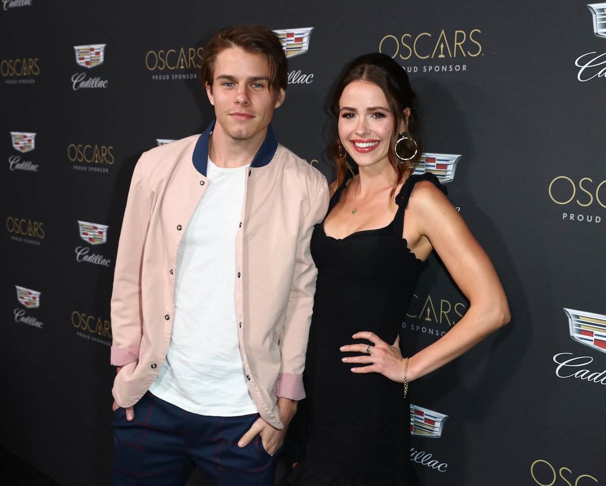 Actors Jake Manley and Jocelyn Hudon post for a photo at an Oscar week event