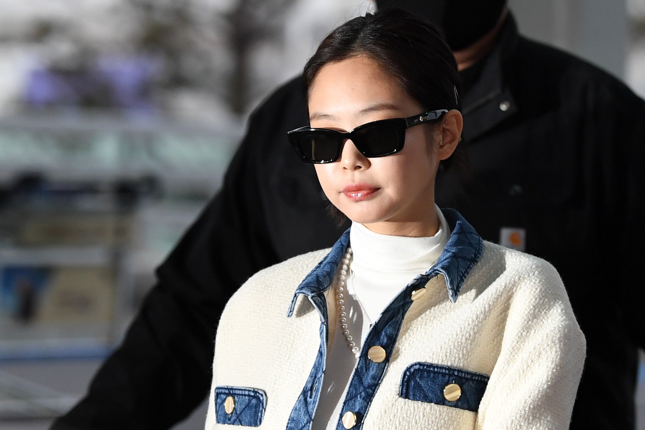 Jennie of BLACKPINK is seen upon departing at Incheon International Airport in black sunglasses and a white jacket