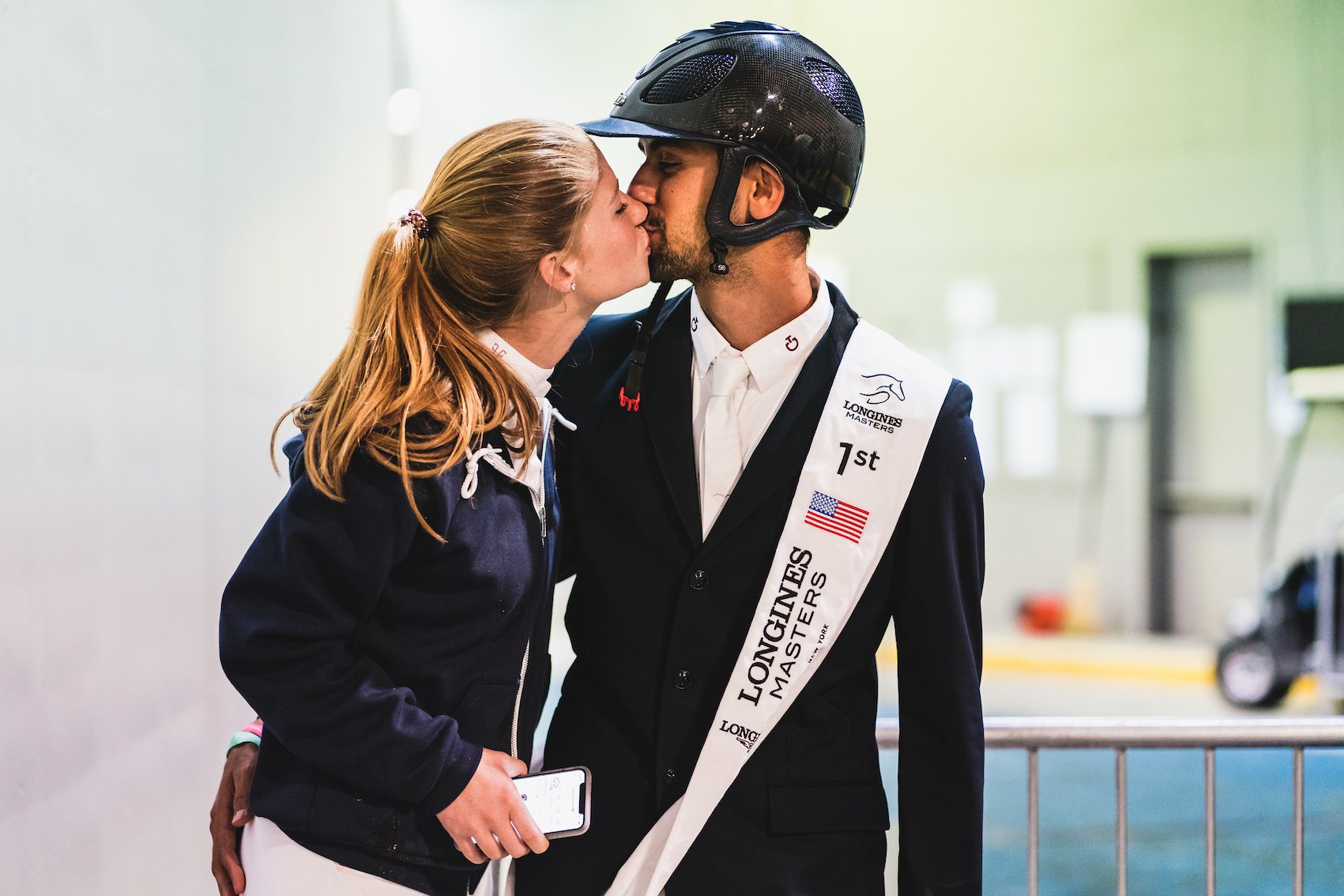 Nayel Nassar kissing Bill Gates' daughter, Jennifer Katharine Gates, at an equestrian tournament while they're both in equestrian outfits