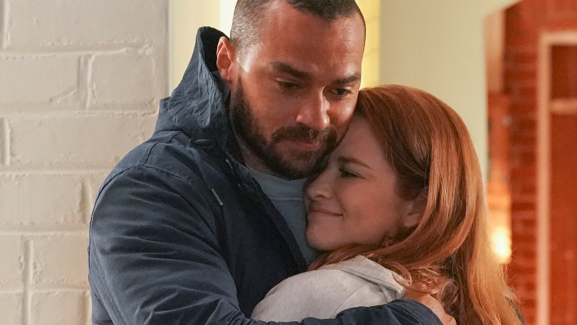 Jesse Williams as Jackson Avery and Sarah Drew as April Kepner hugging in ‘Grey’s Anatomy’ Season 17 Episode 14, ‘Look Up Child.’