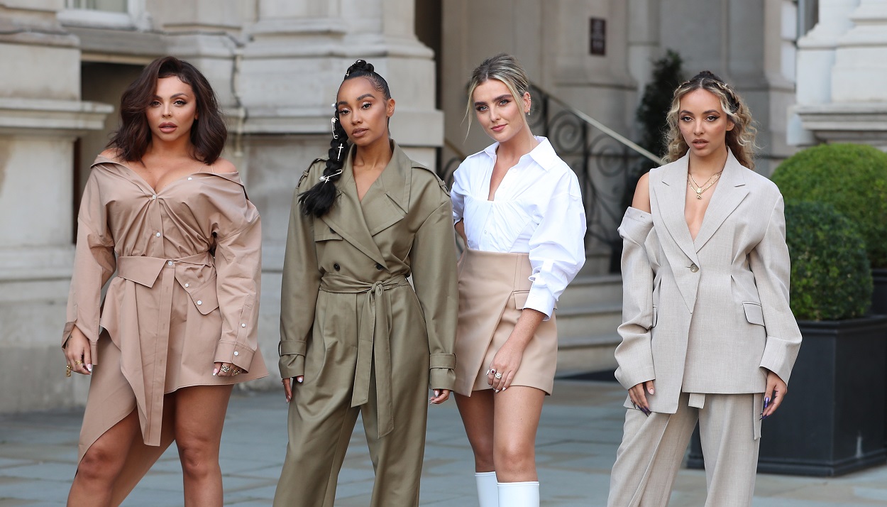 Jesy Nelson and Little Mix pose in neutral clothing for a photo
