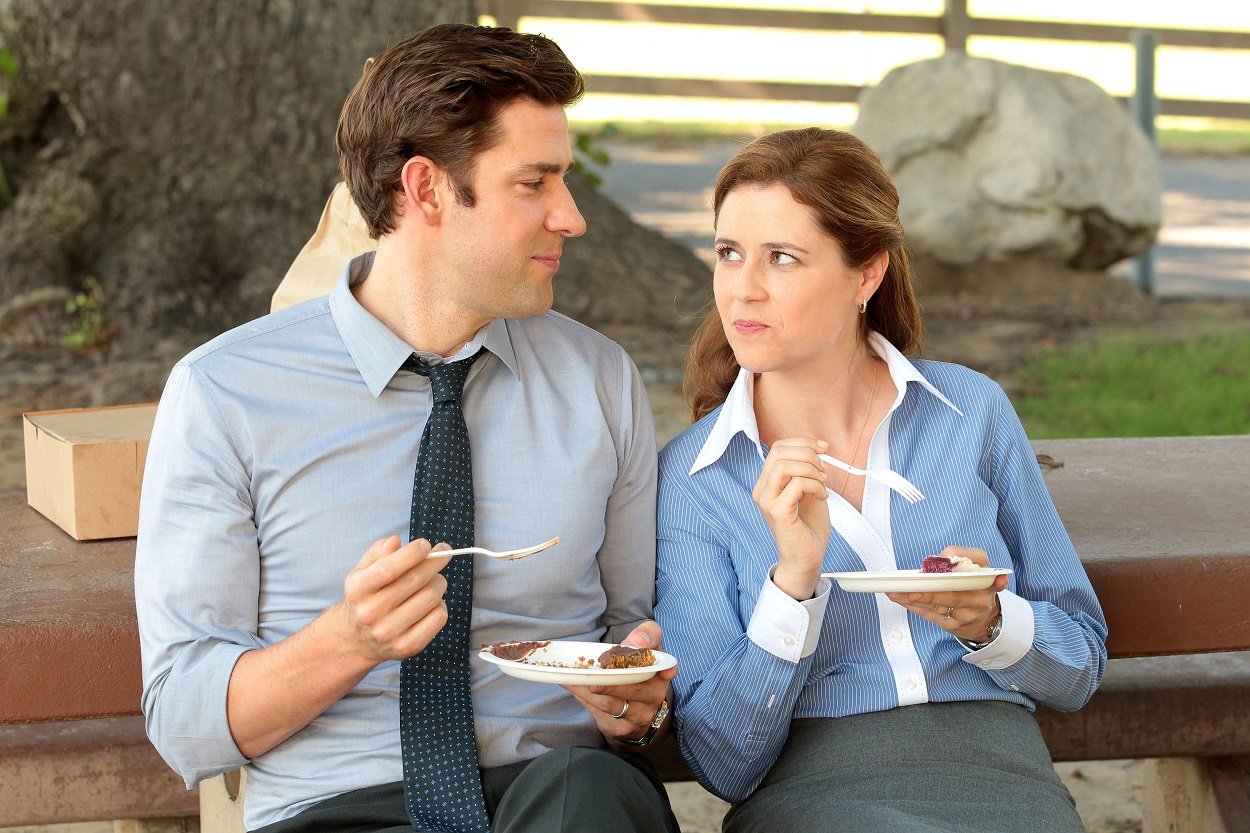 The Office stars Jenna Fischer as Pam and John Krasinski as Jim share a smile while eating pie