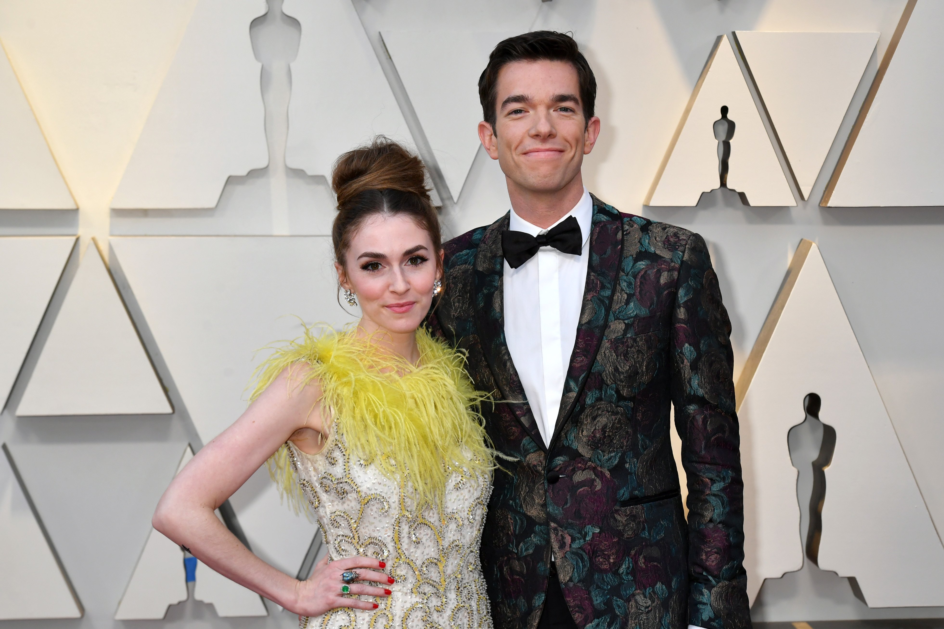 Annamarie Tendler and John Mulaney pose for photos after arriving at the 91st Annual Academy Awards in 2019