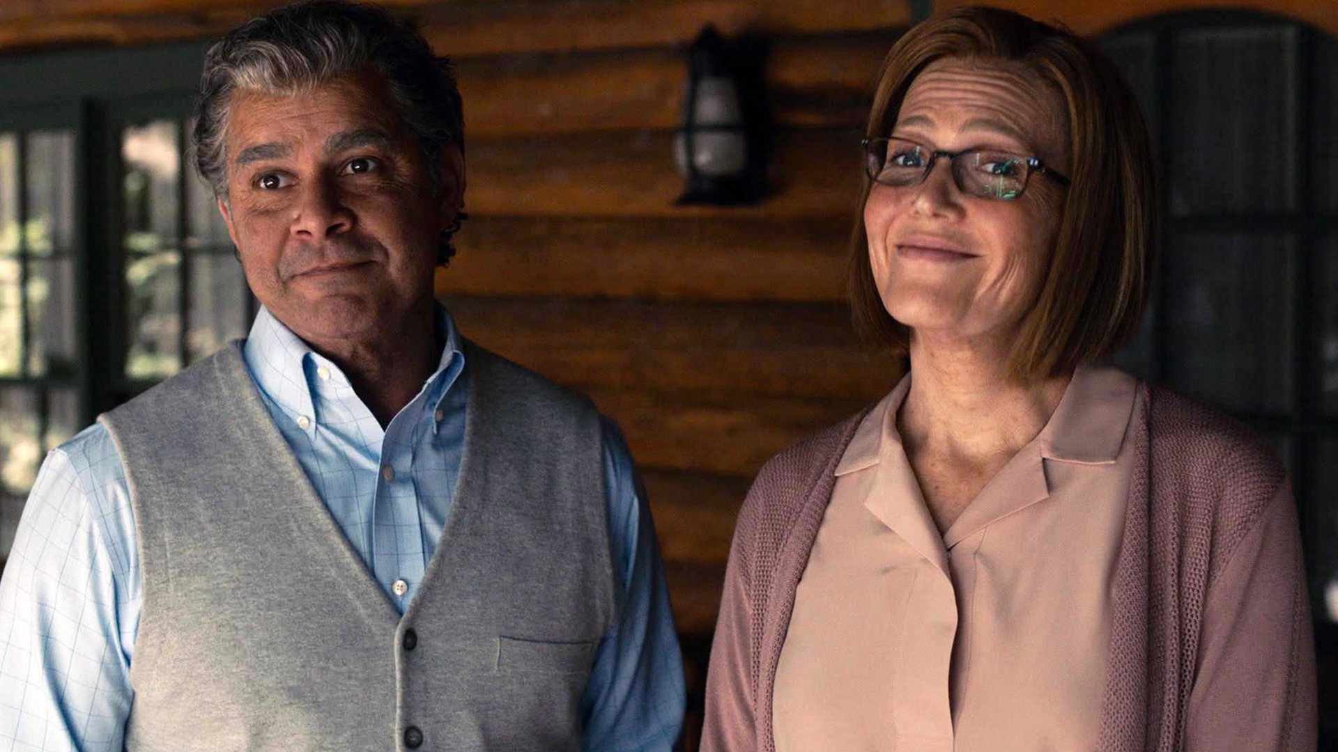 Jon Huertas as Miguel and Mandy Moore as Rebecca smiling at the Pearson family cabin in the ‘This Is Us’ Season 5 premiere