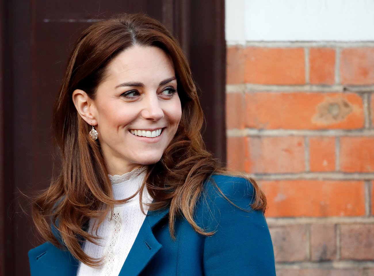 Kate Middleton smiling, looking to the side