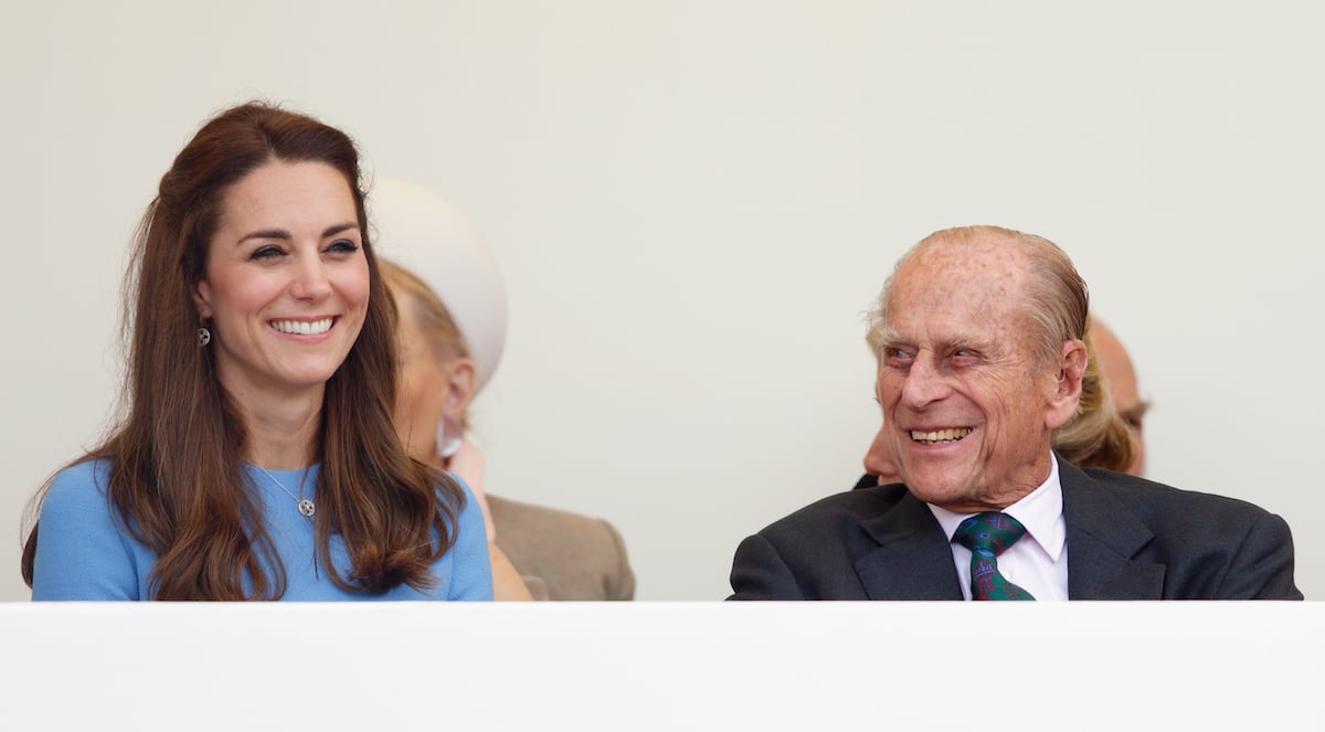 Catherine, Duchess of Cambridge and Prince Philip, Duke of Edinburgh smiling and laughing