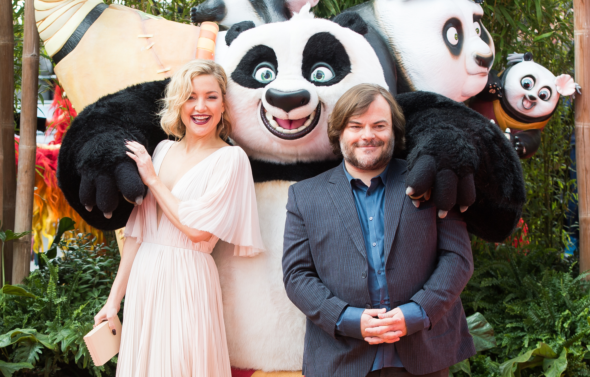 Kate Hudson and Jack Black posing with a Kung Fu Panda mascot