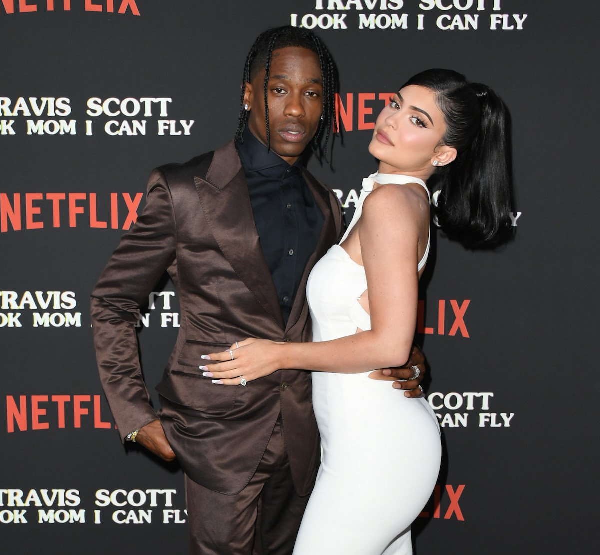 Travis Scott and Kylie Jenner attend the Premiere Of Netflix's "Travis Scott: Look Mom I Can Fly" and pose together