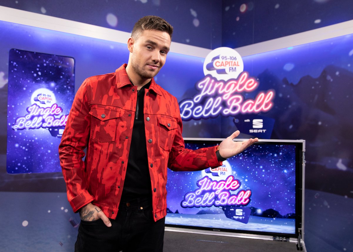 Liam Payne from One Direction in a red jacket